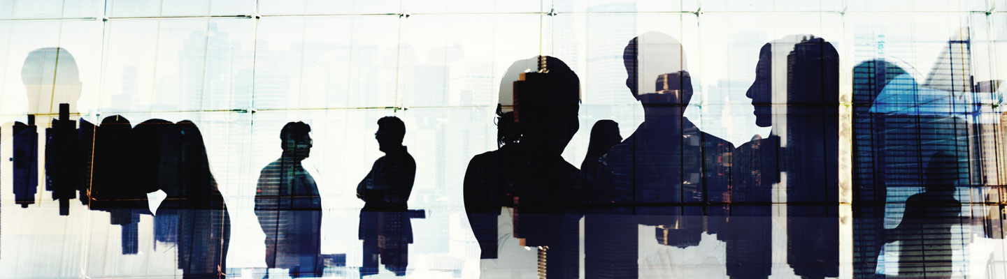 Silhouette of business people in discussion in a cityscape concept