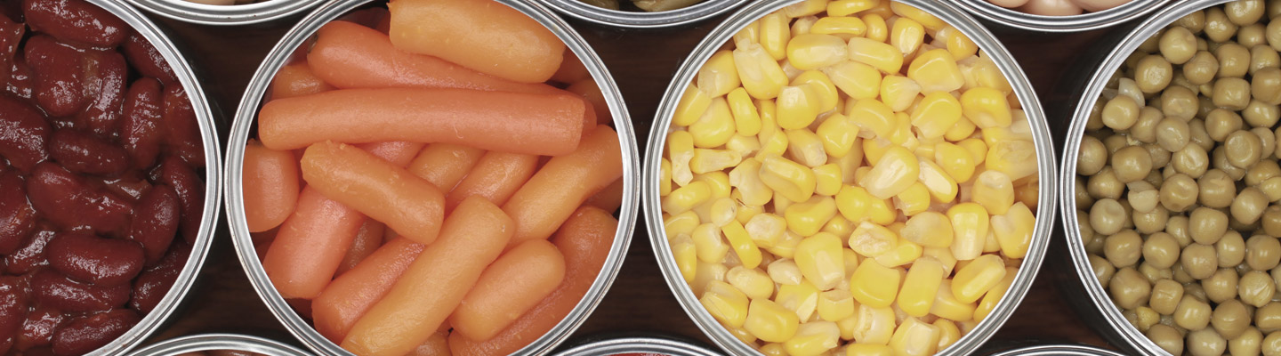 Different kinds of vegetables including corn, peas and tomatoes in cans